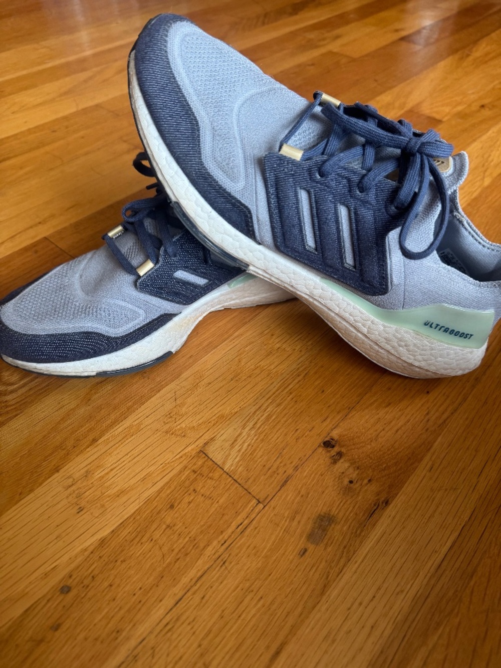 Adidas Ultraboost 22 in the "Halo Silver / Shadow Navy / Linen Green